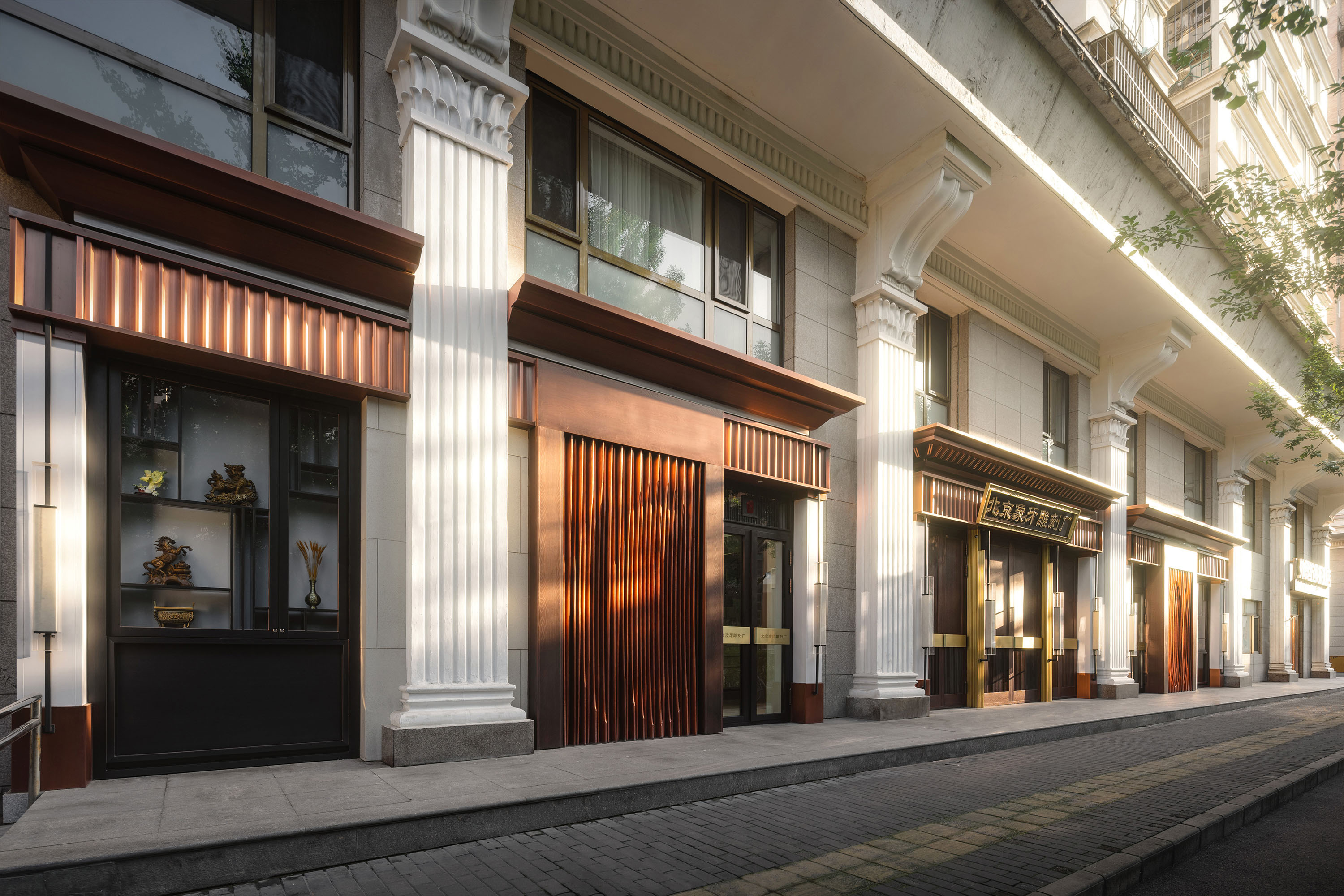 the facade reinterprets Beijing’s historic mammoth ivory carving exhibition with contemporary elegance